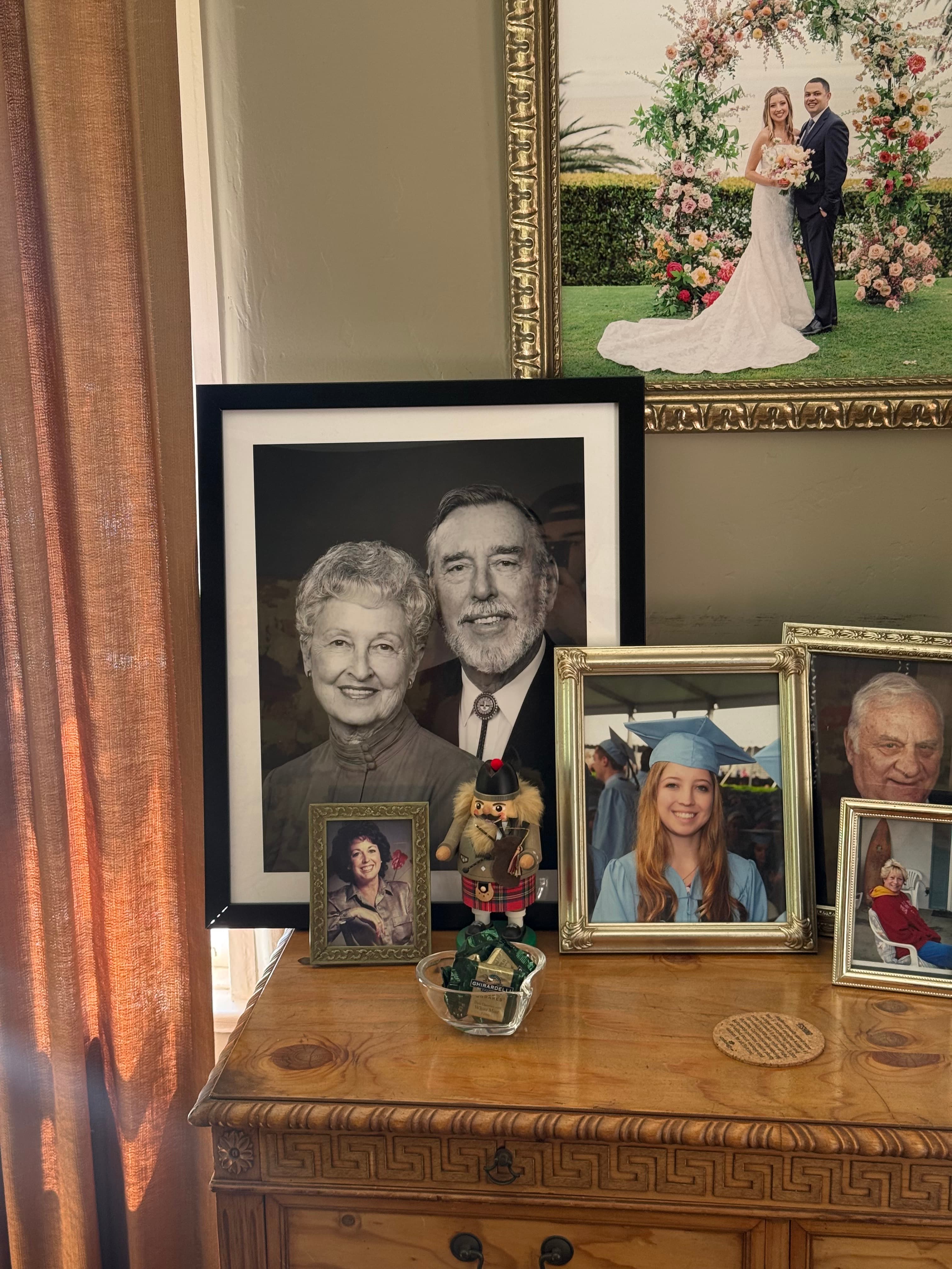 The Heirloom portrait displayed among family photos in the customer's home